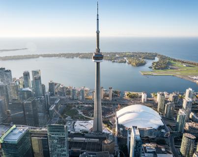 aerial view of the waterfront showing the CN Tower, buildings, and the Toronto Islands