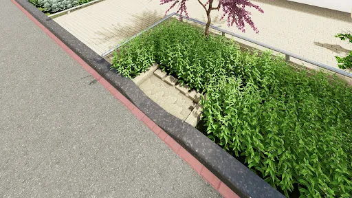 A concrete stormwater planter along a street edge, featuring green vegetation and a series of concrete sediment pads embedded in the ground.  A small tree and railing are visible in the background on a raised sidewalk.