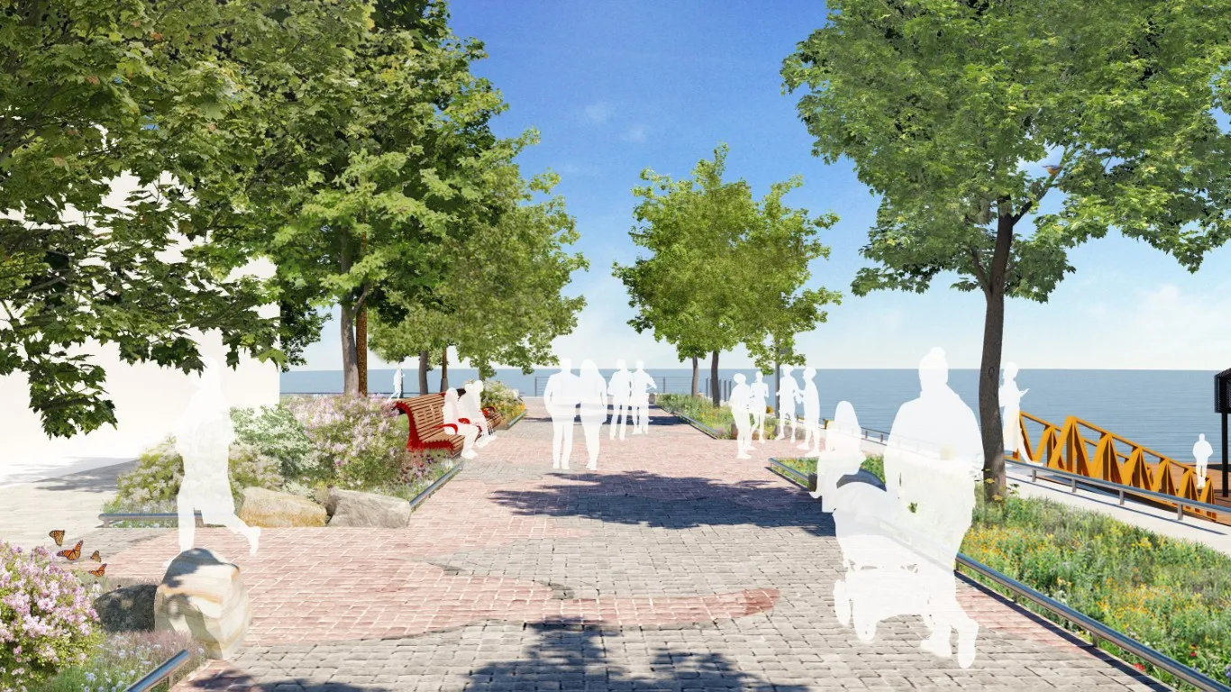 A rendering of the extended Water's Edge Promenade, featuring a wide granite walkway framed by mature trees and plant beds. People are shown walking, sitting on curved red benches, and enjoying views of the water.