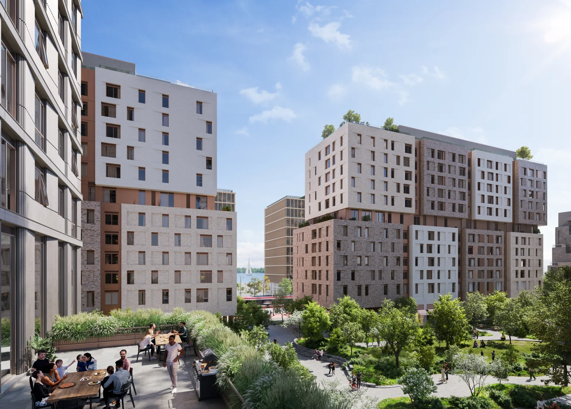 Aerial view of the Quayside development showing the mix of residential towers, mid-rise buildings, and expansive green spaces integrated into the waterfront community. 2/3