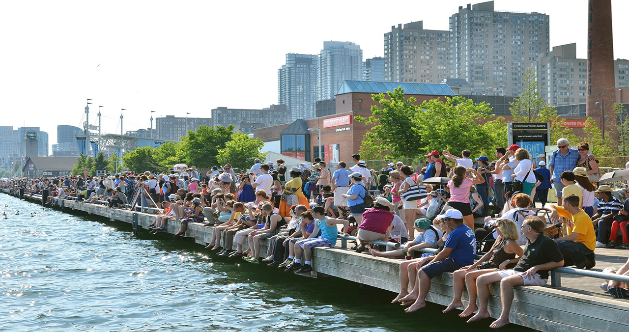 people on toronto waterfront dock wall