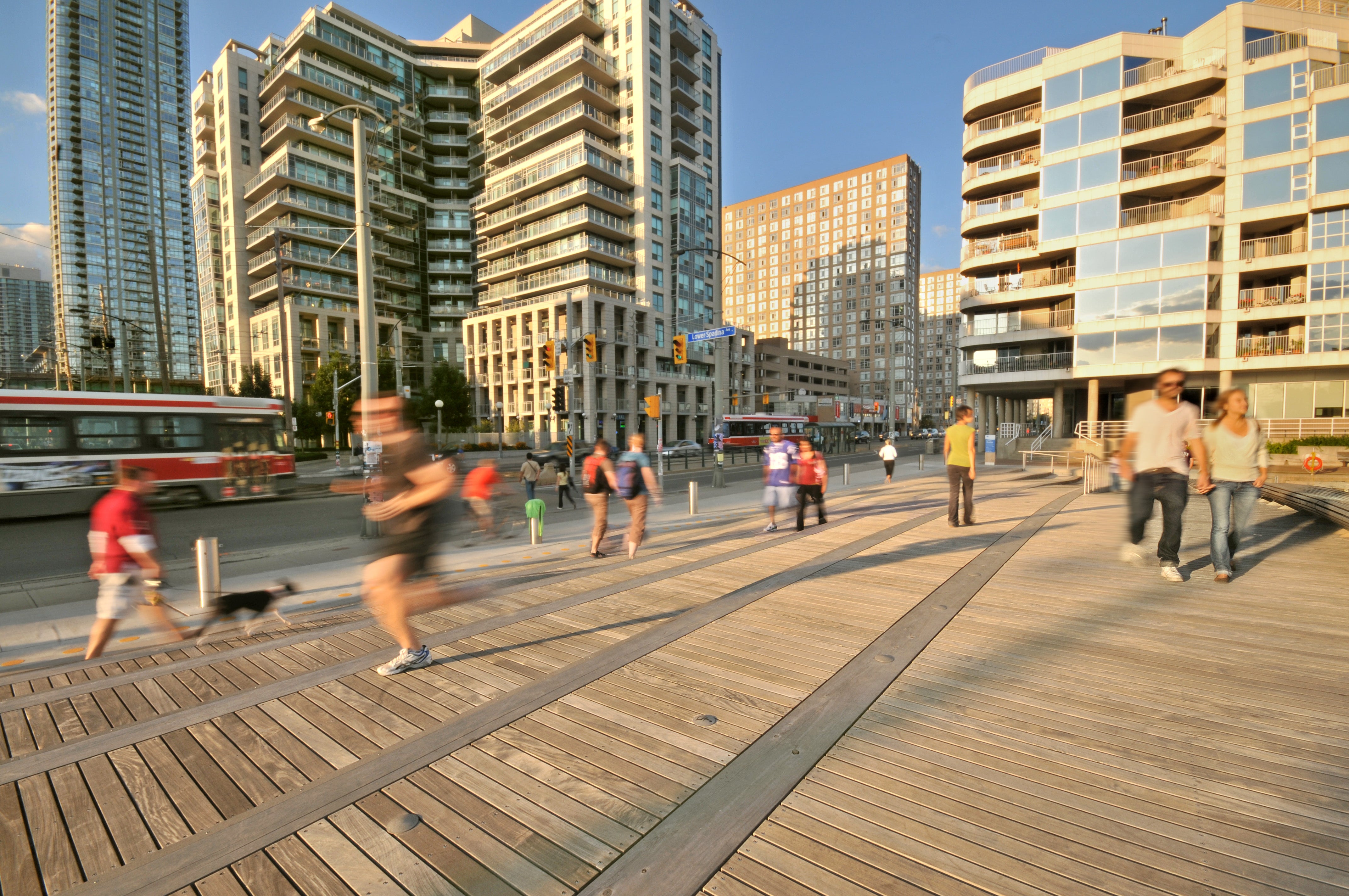 people walking and jogging along the busy waterfront