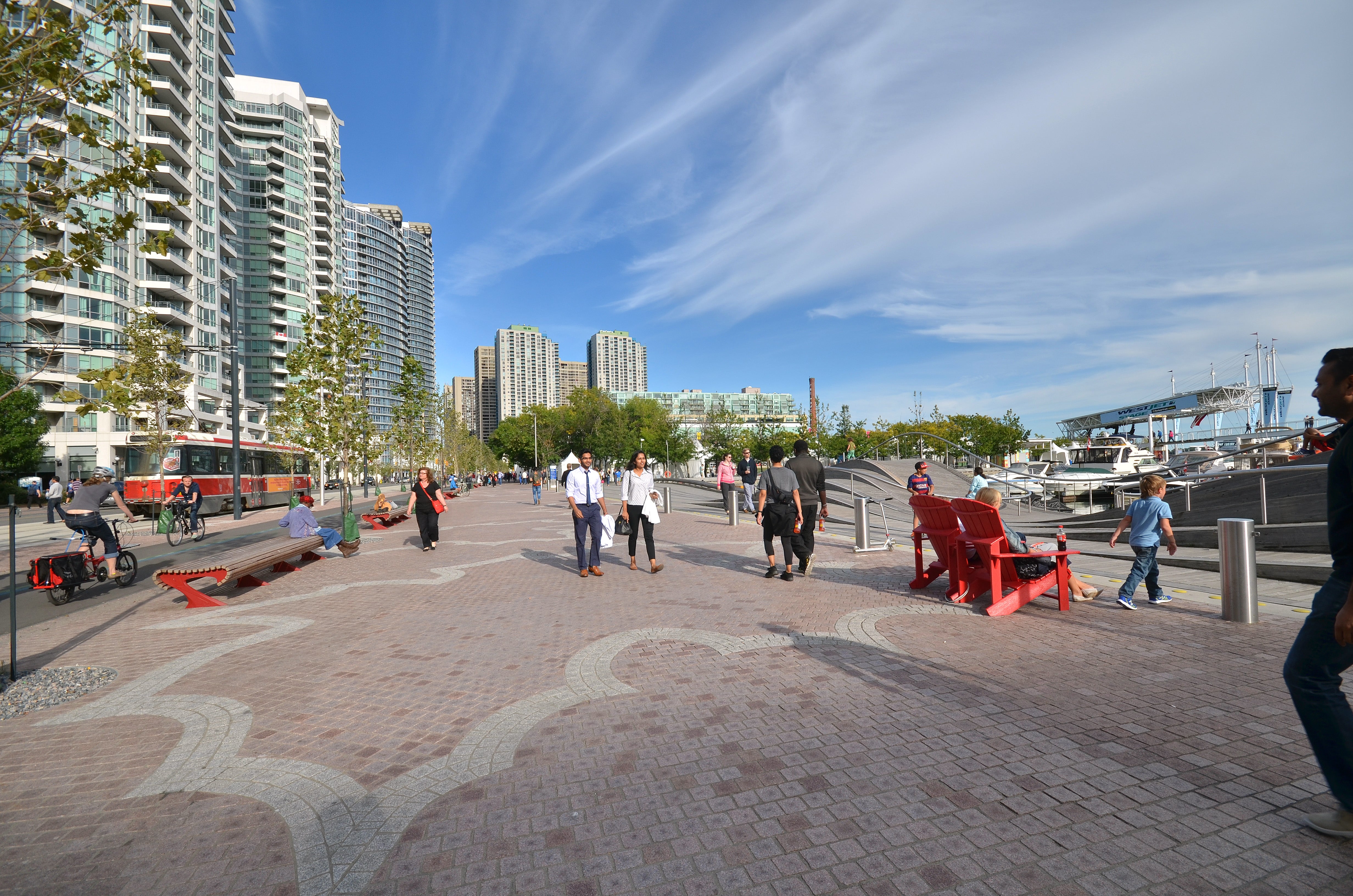 pedestrians strolling along the granite promenade