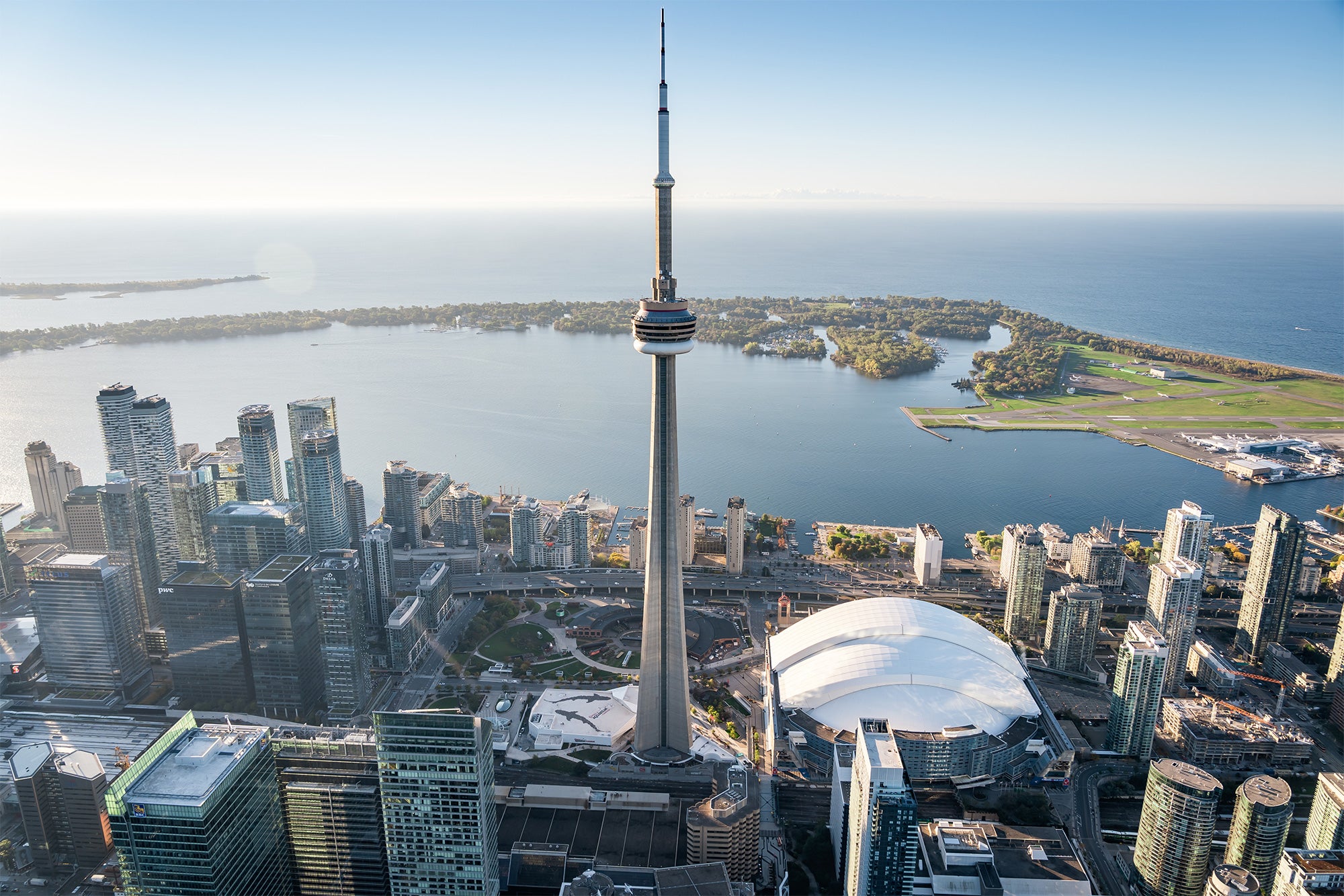 aerial view of the waterfront showing the CN Tower, buildings, and the Toronto Islands