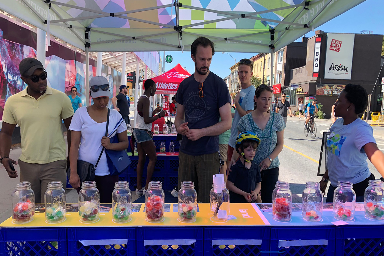 people exploring waterfront vision activities at a street market