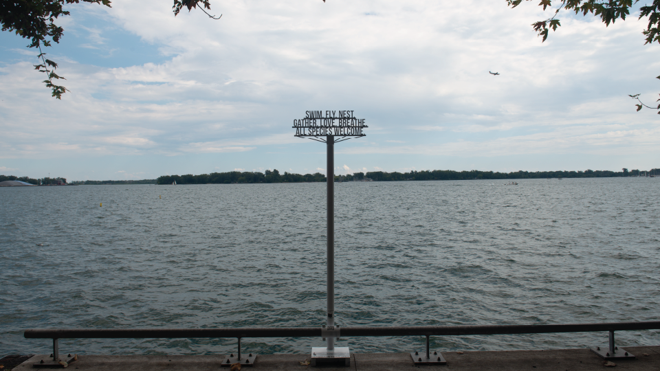 a metal public art installation right at the water's edge