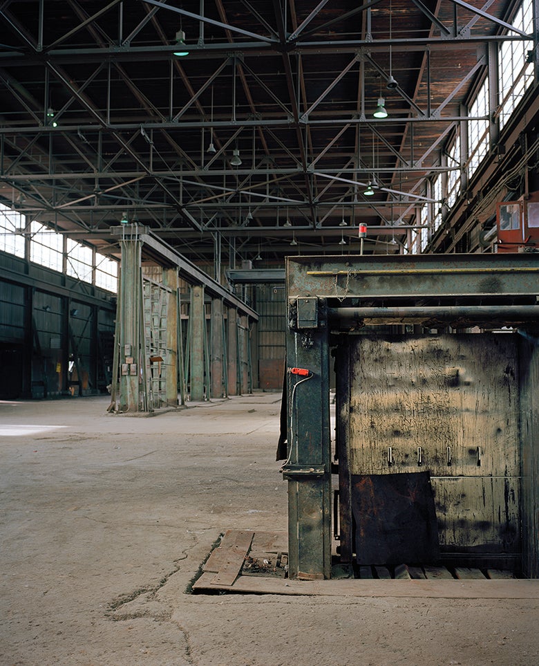An empty industrial warehouse with high ceilings. 