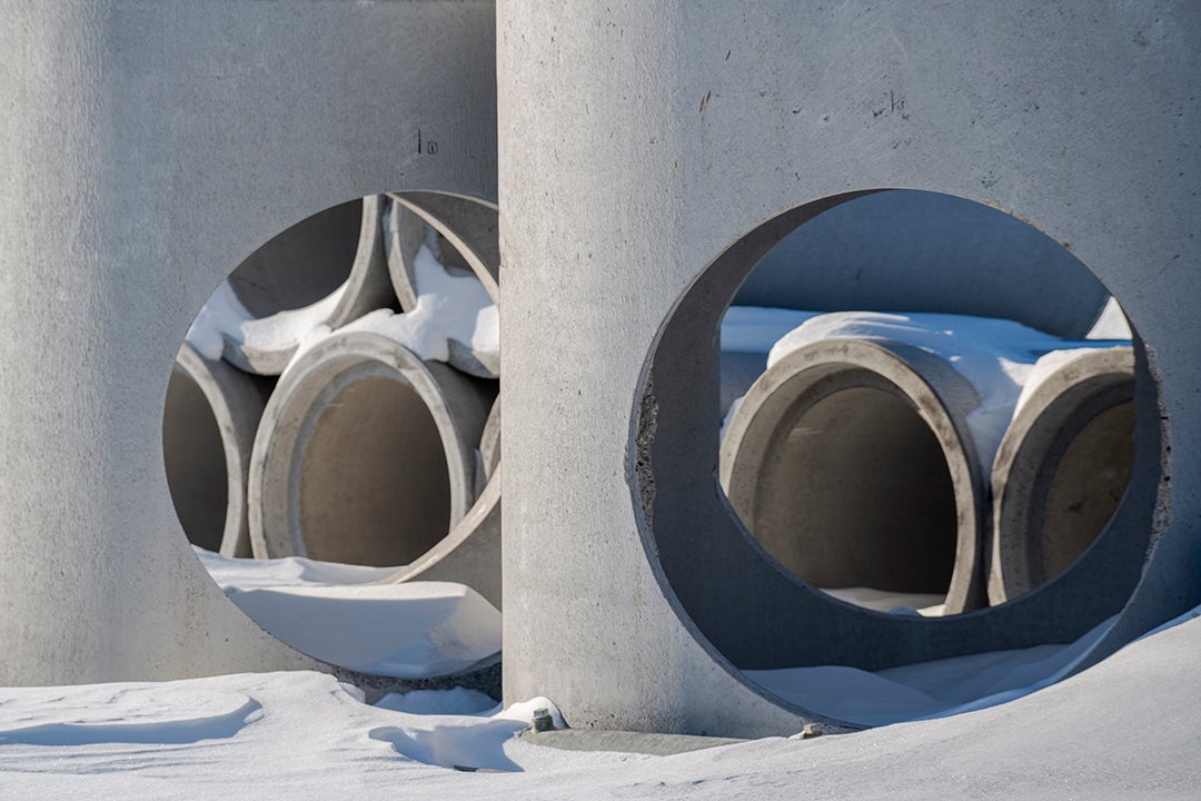 Cement tubes covered in snow.