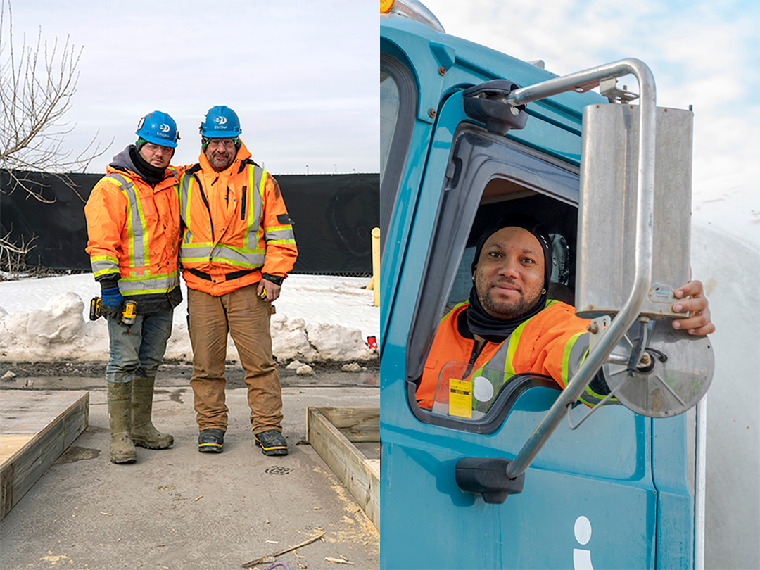 People in construction gear smile for the camera. 