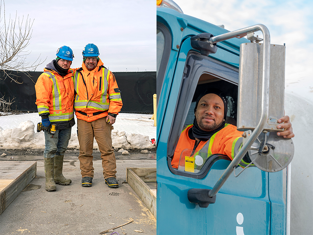 People in construction gear smile for the camera.