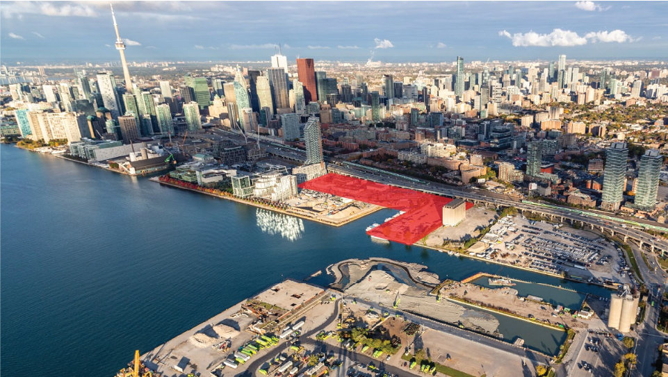 Aerial of downtown core with land parcel outlined in red. 