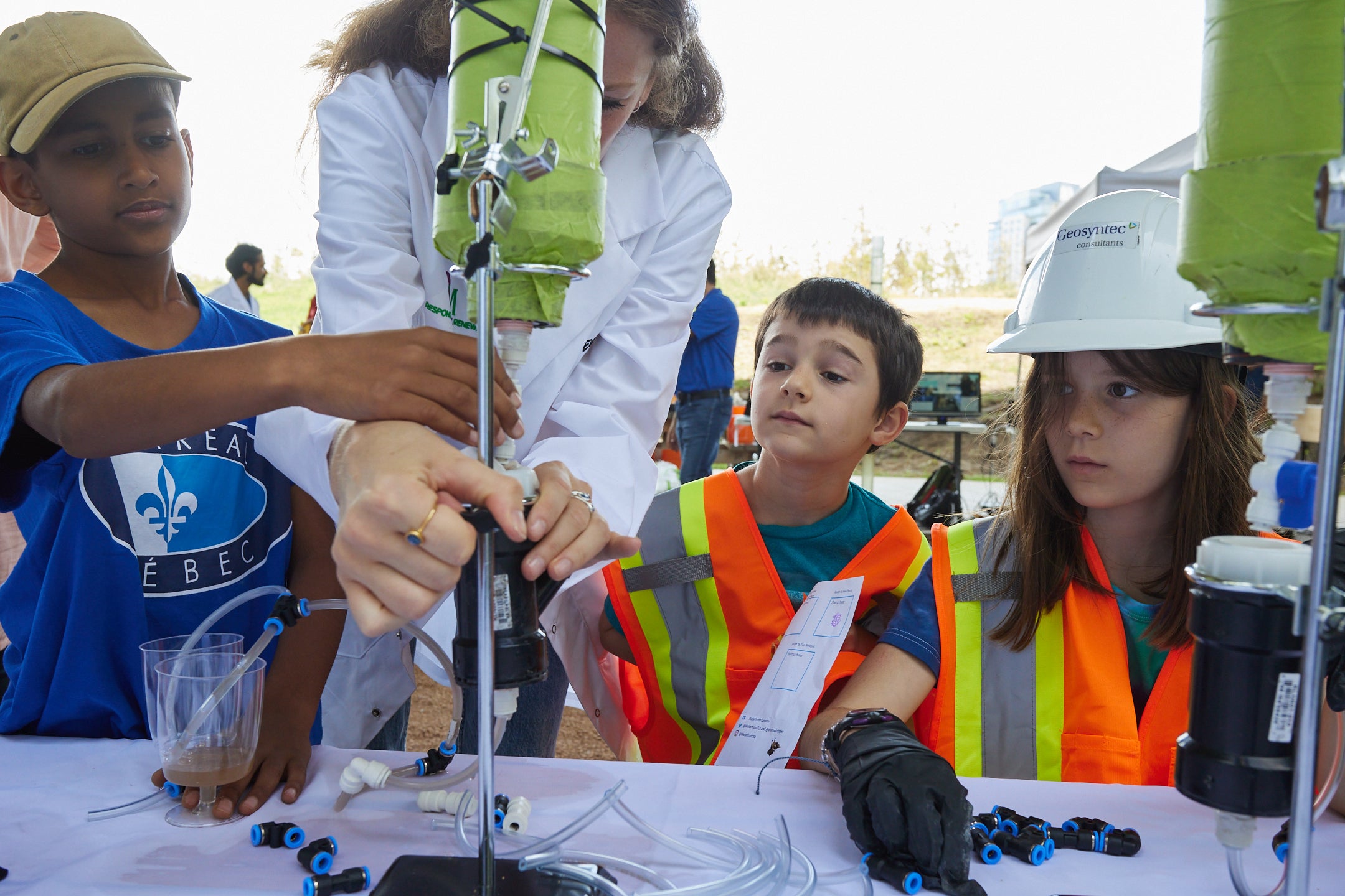 a group of children working on a science experiment