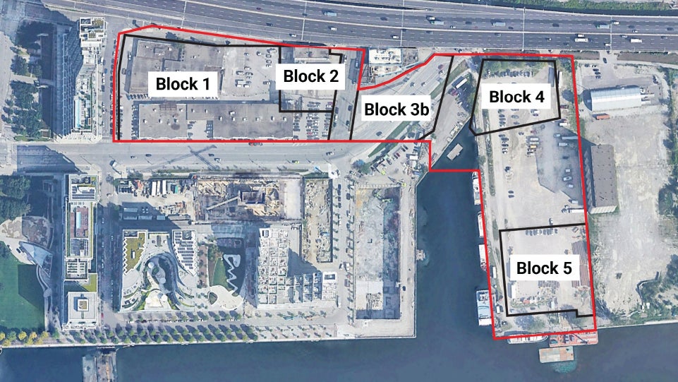 Satellite image of a downtown waterfront with site outlined in red and black. 