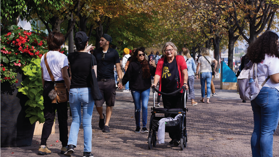 A person with a mobility aid on the Water's Edge Promenade