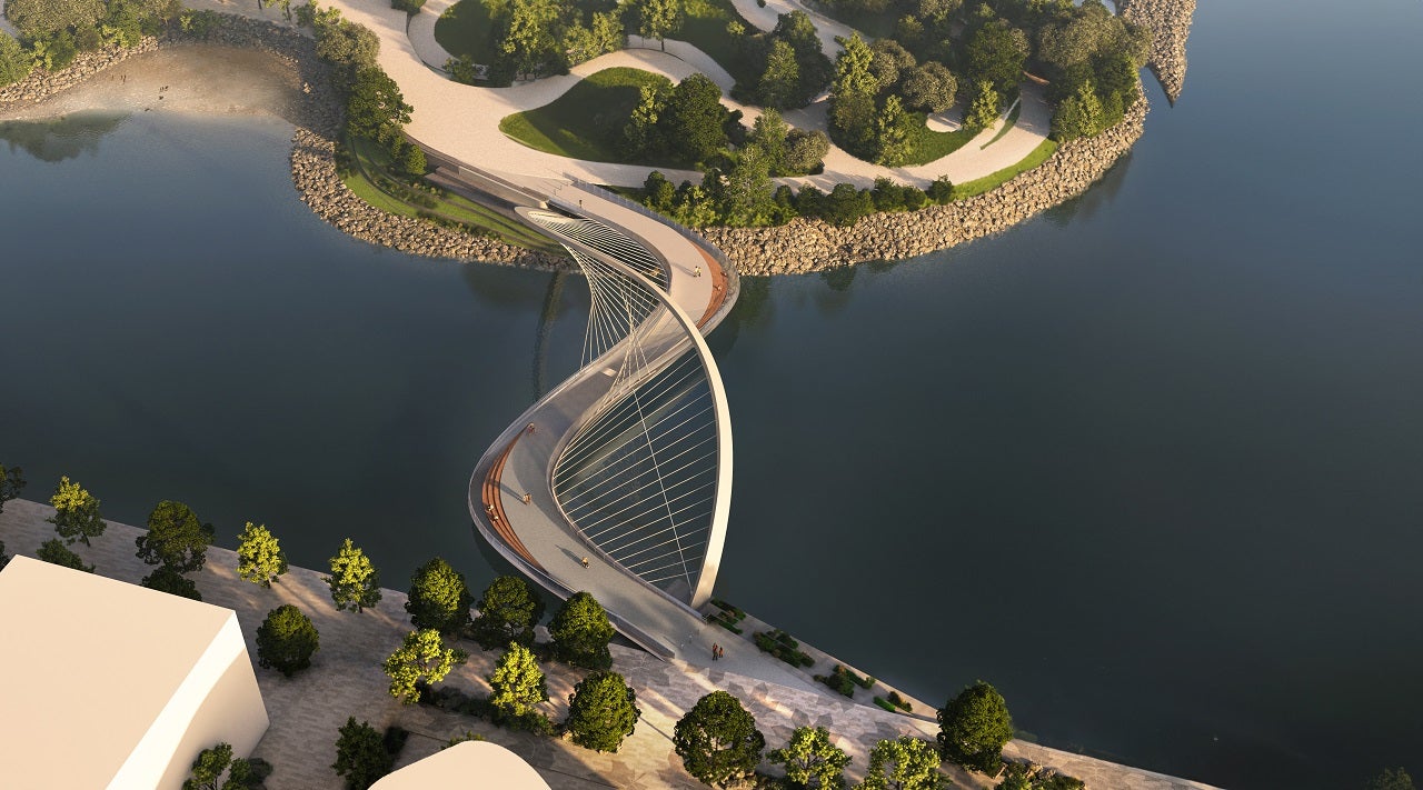 An s-shaped pedestrian bridge being shown from above in a rendering.