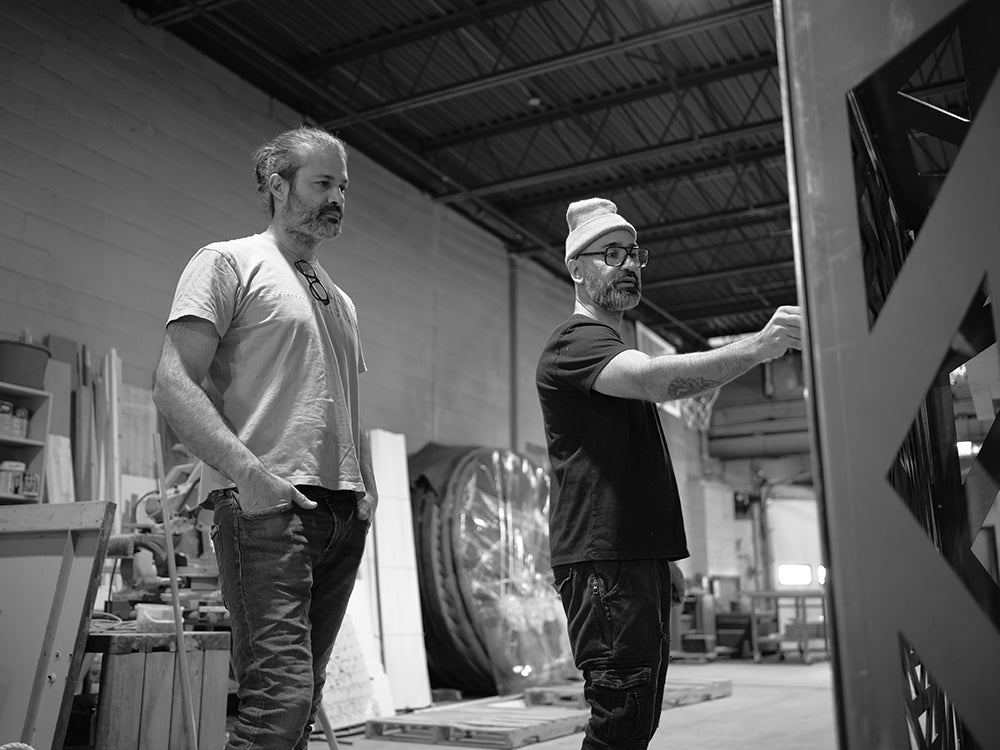 Two artists working in a studio.