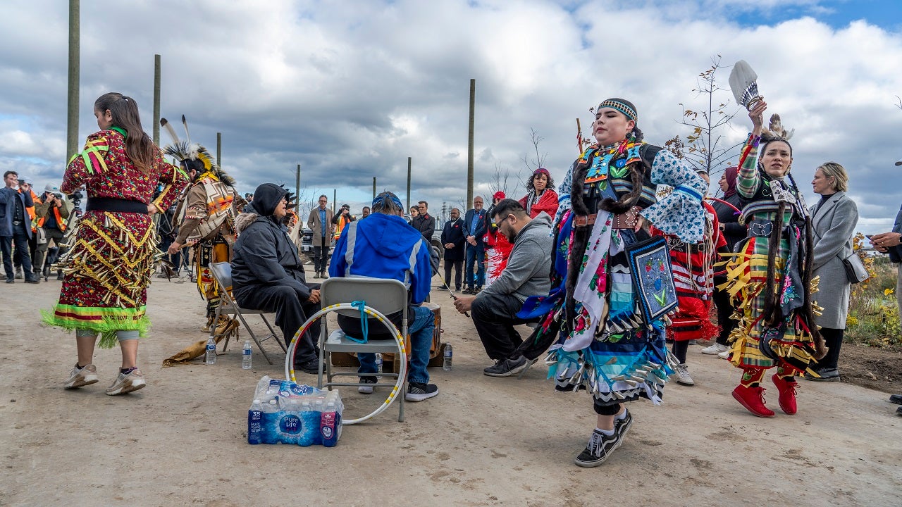 People gathered at an outdoor Indigenous naming celebration