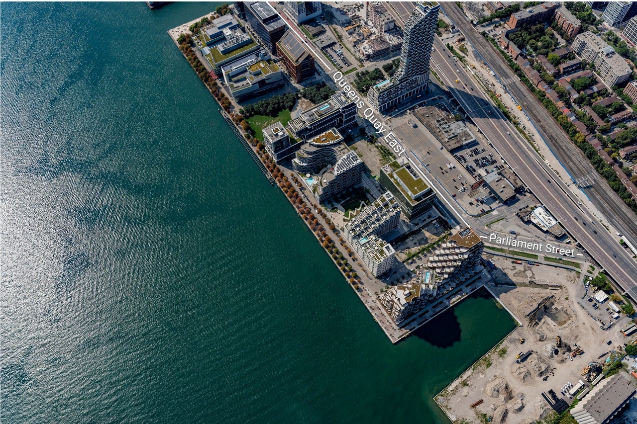 Aerial view of the East Bayfront waterfront neighbourhood along Queens Quay East and Parliament Street.