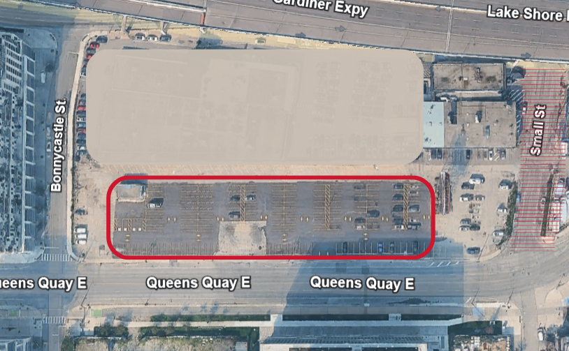 An aerial showing view of a parking lot at Queens Quay East.