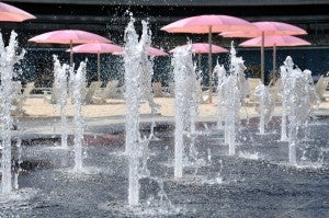 close-up of water spraying out of a splash pad