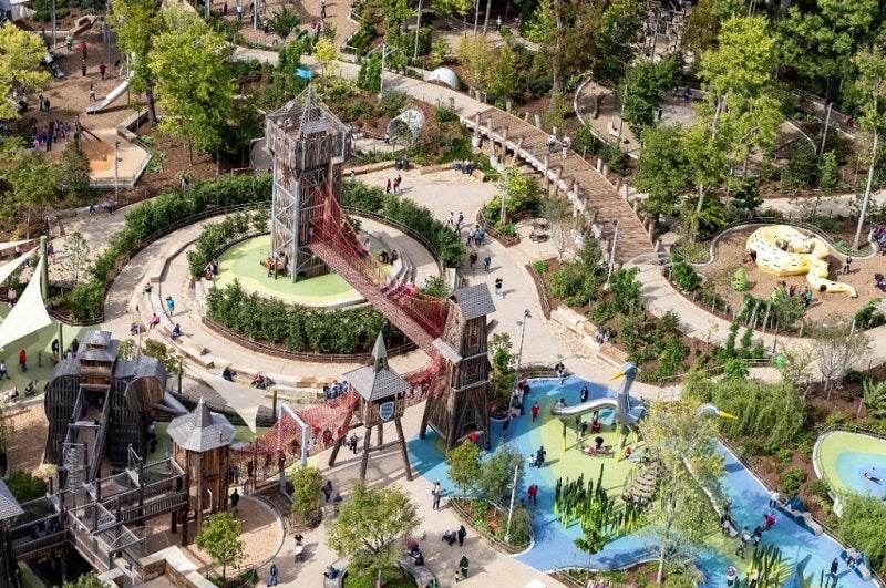 aerial view of a busy park with lots of play structures and water features