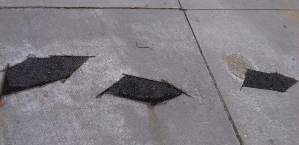 A 'fishectomy' in May 2013 left gaps in the sidewalk.