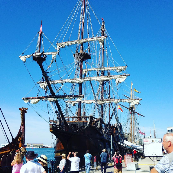 A docked ship towers several metres high over onlookers at the Redpath Waterfront Festival this July.