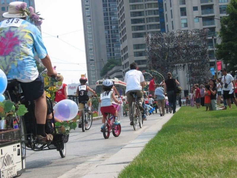 For 10 days in August 2006, the two south lanes of traffic on Queens Quay were replaced with bicycle lanes, a kilometre-long stretch of 12,000 red geraniums and a picnic lawn the length of almost ten football fields.