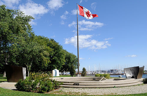 The Canadian Flag waves over the Victory Peace monument commemorating Canadian troops.