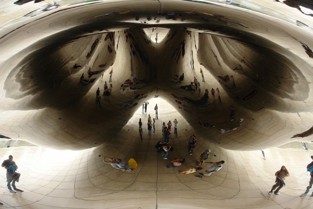 close-up of Cloud Gate surrounded by people