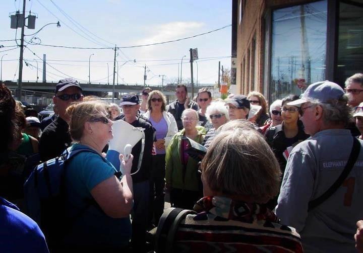 Waterfront Toronto staff and community members lead a walking tour through the West Don Lands.