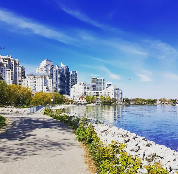 A waterfront trail next to condo buildings. 
