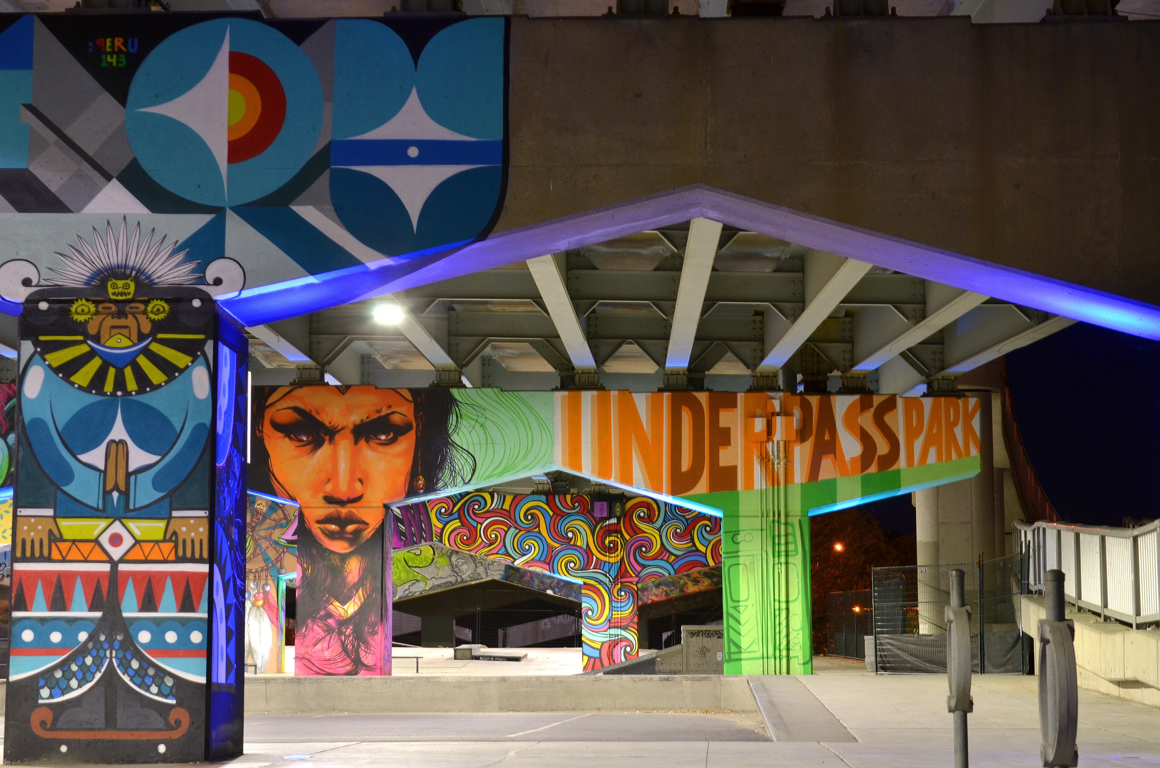 Graffiti artwork flanks the imposing concrete beams and columns at Underpass Park.