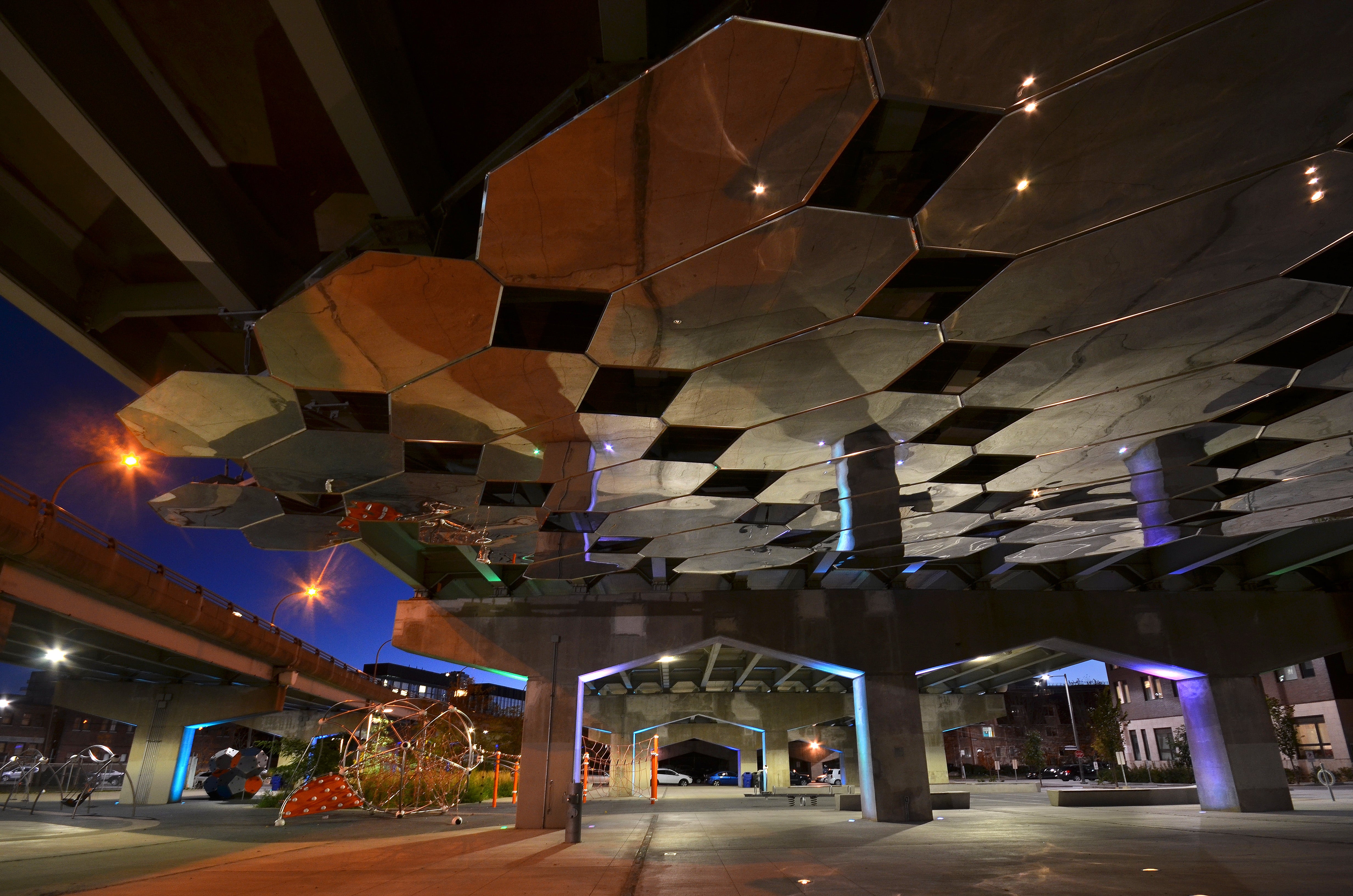 An image of Mirage, a stunning public art installation by Toronto-based artist Paul Raff. It is composed of 57 octagonal mirrored stainless steel surfaces.