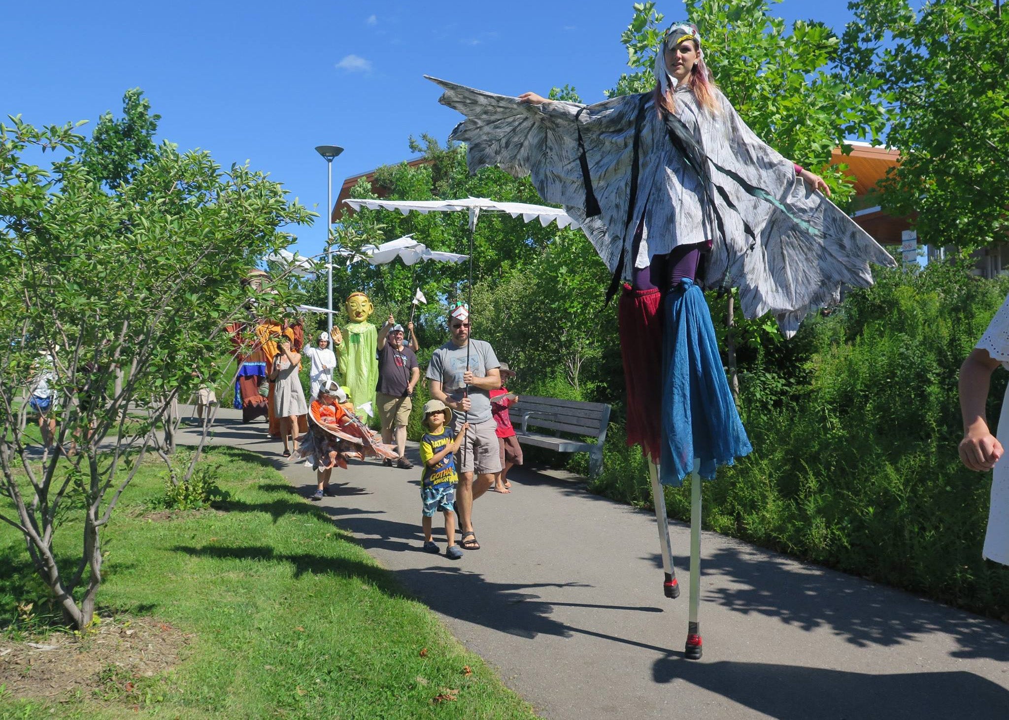 Following an afternoon of workshops, Shadowland Theatre led participants through the paths at Corktown Common to Front Street for a celebratory parade.
