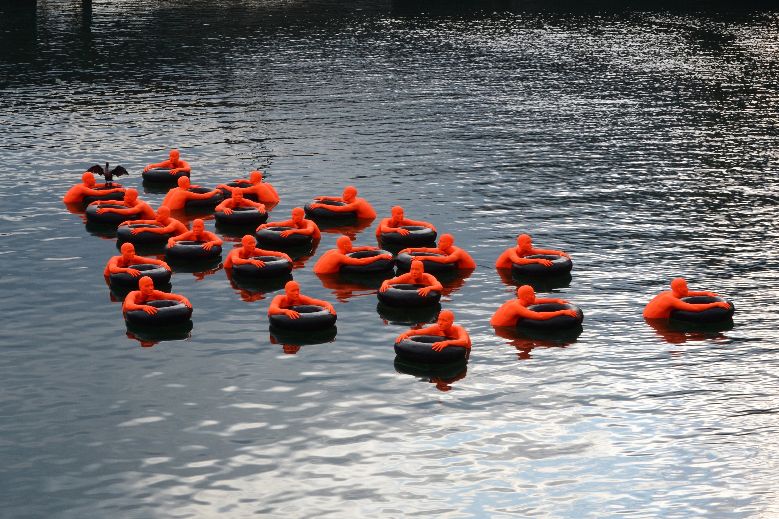 Image of the Safety Orange Swimmers floating in the water.