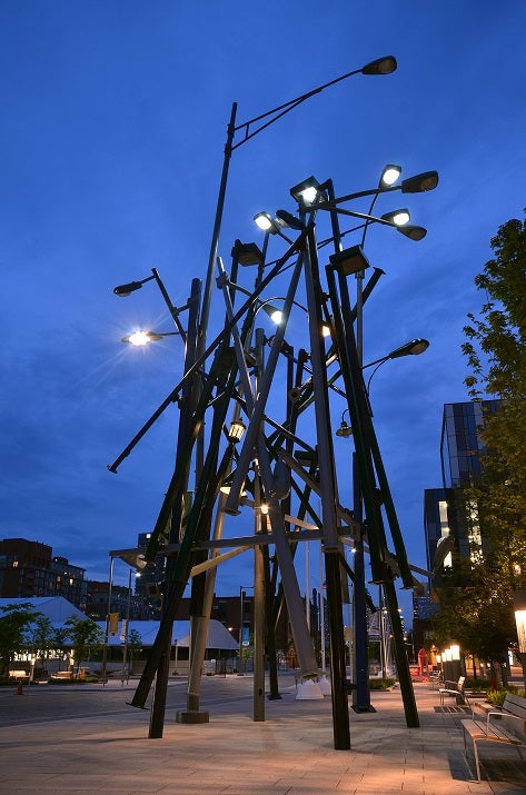 Group of lamp posts at night time