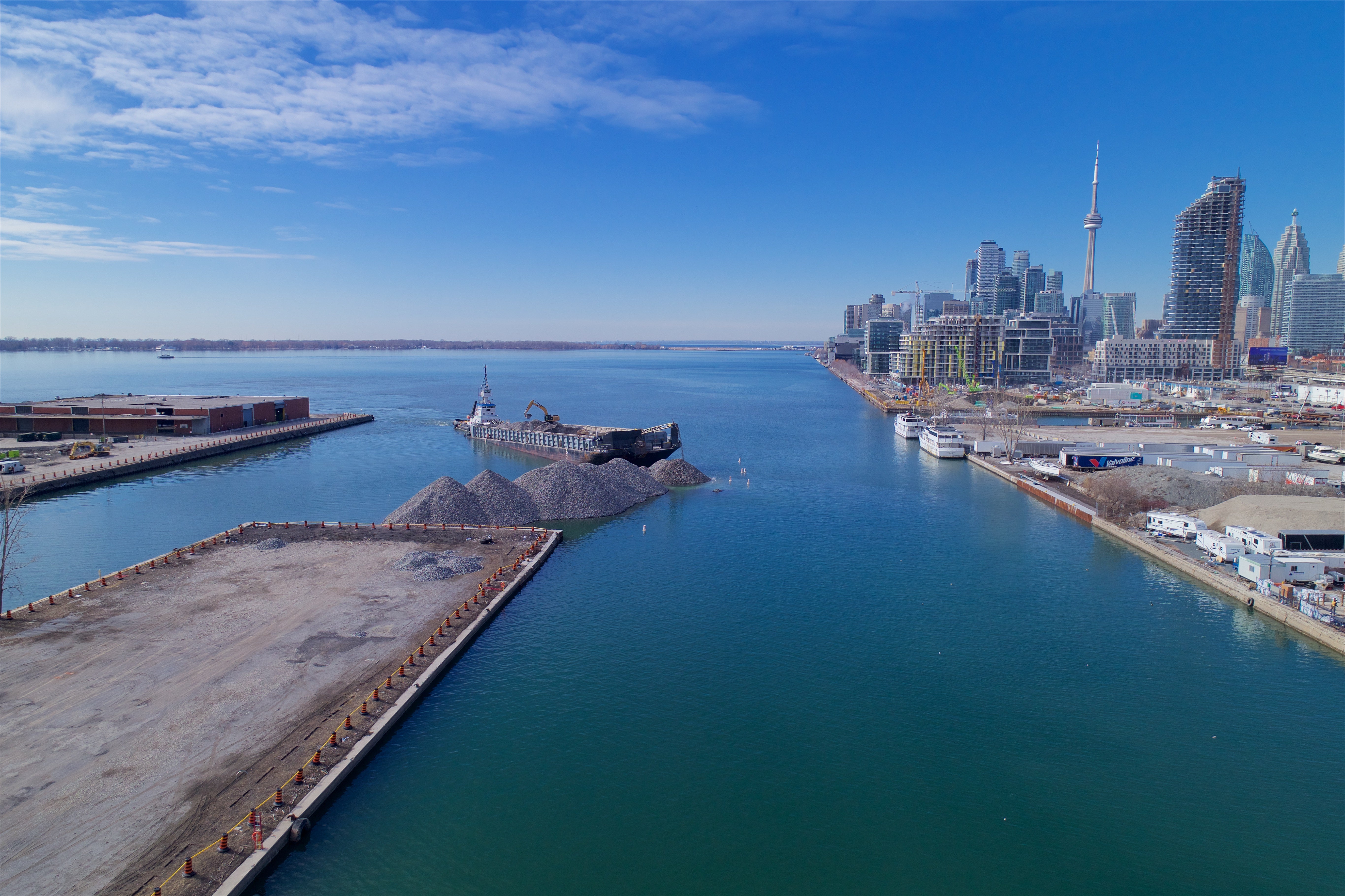 A west-facing view of the lake-filling operations in the Port Lands, which began in December 2017 as part of the larger Port Lands Flood Protection project.