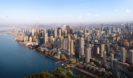 Aerial view of Toronto skyline with CN Tower, along Lake Ontario on a clear day.