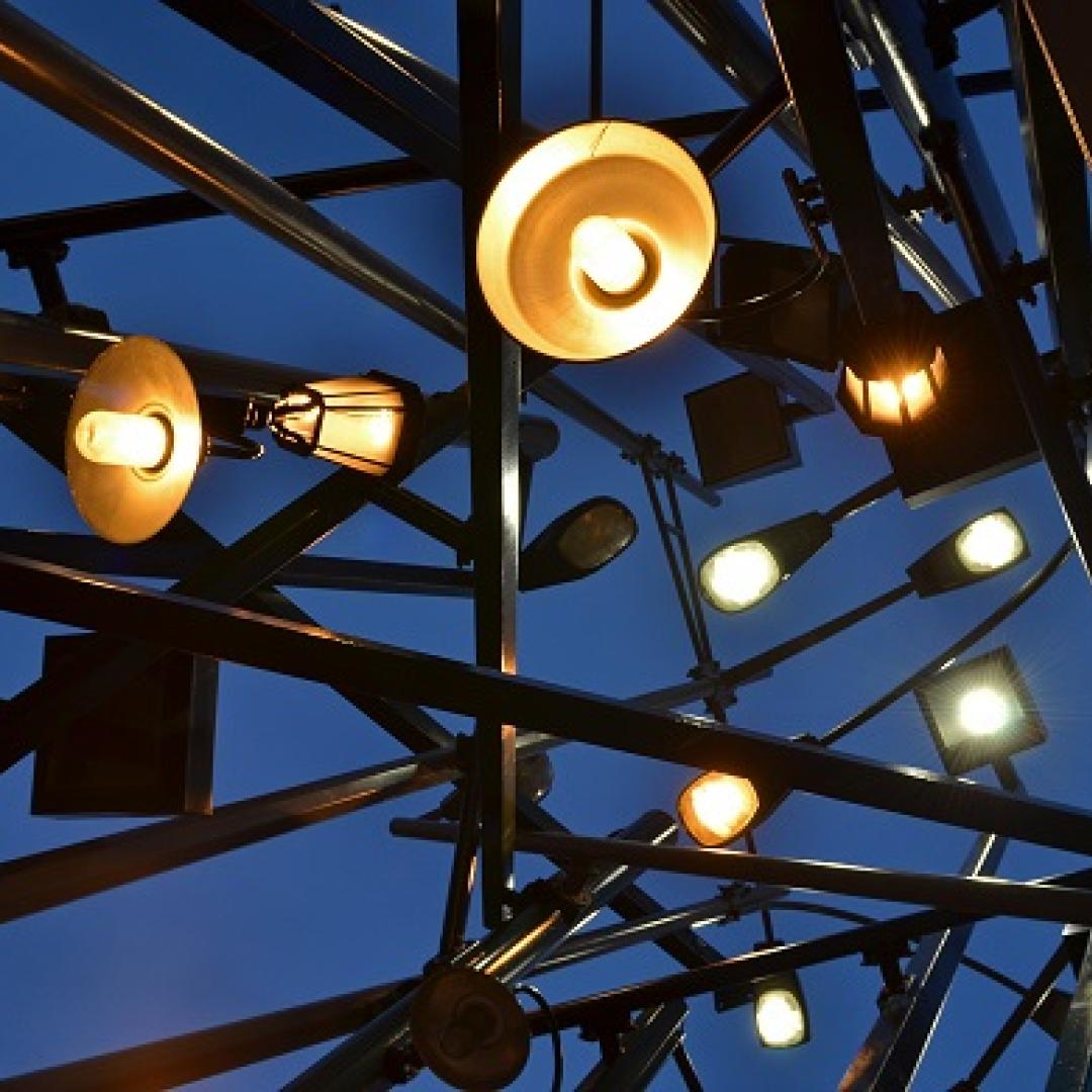 a close up image of street lamp posts at night