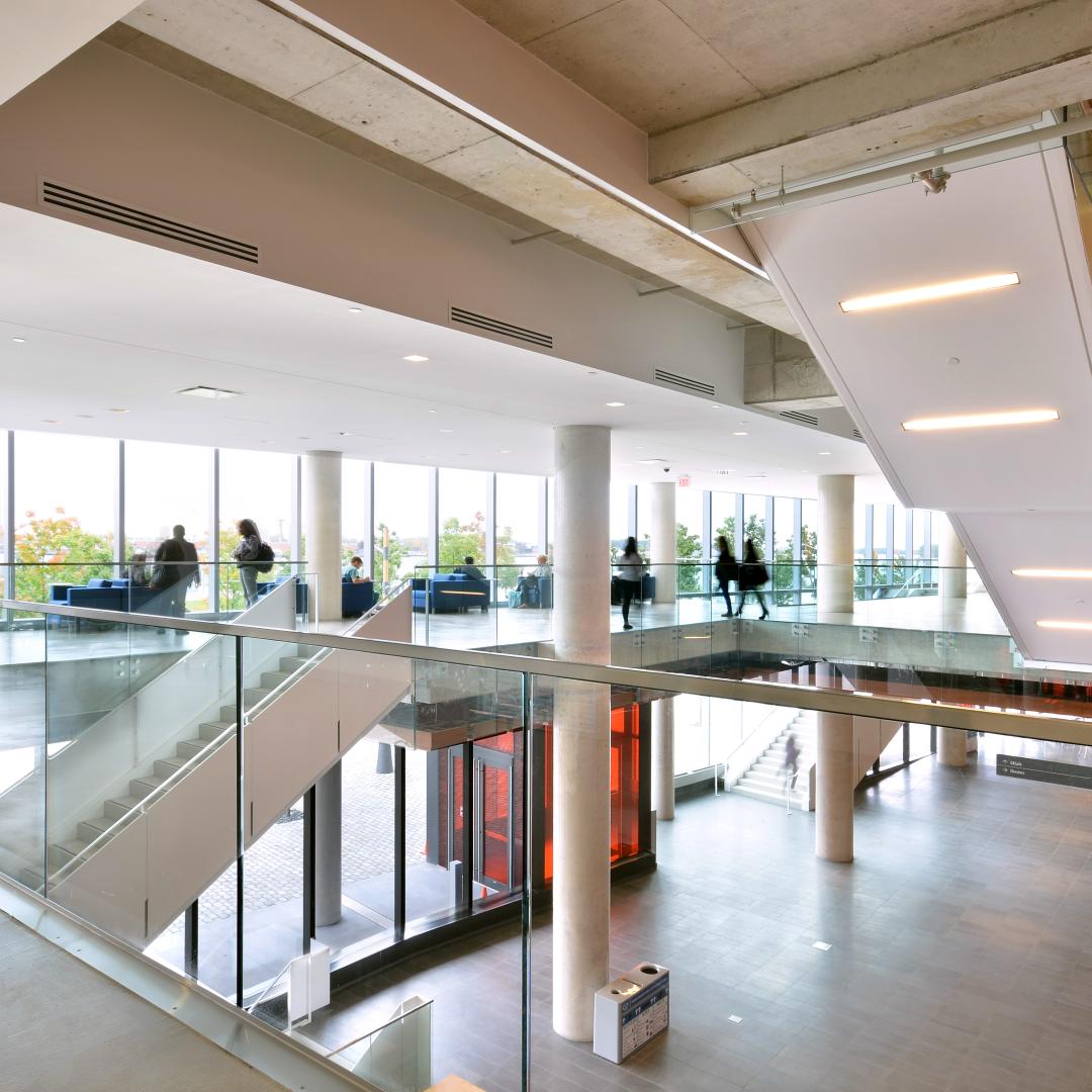 A photo of the interior of George Brown College's Waterfront Campus - showing stairs and the atrium