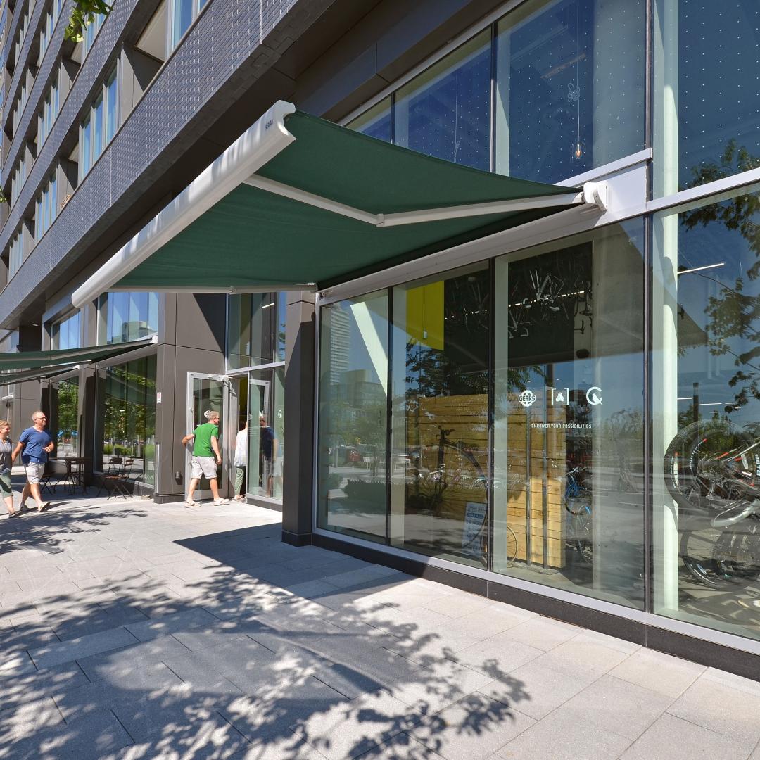 a photo a building and sidewalk showing the ground floor retail