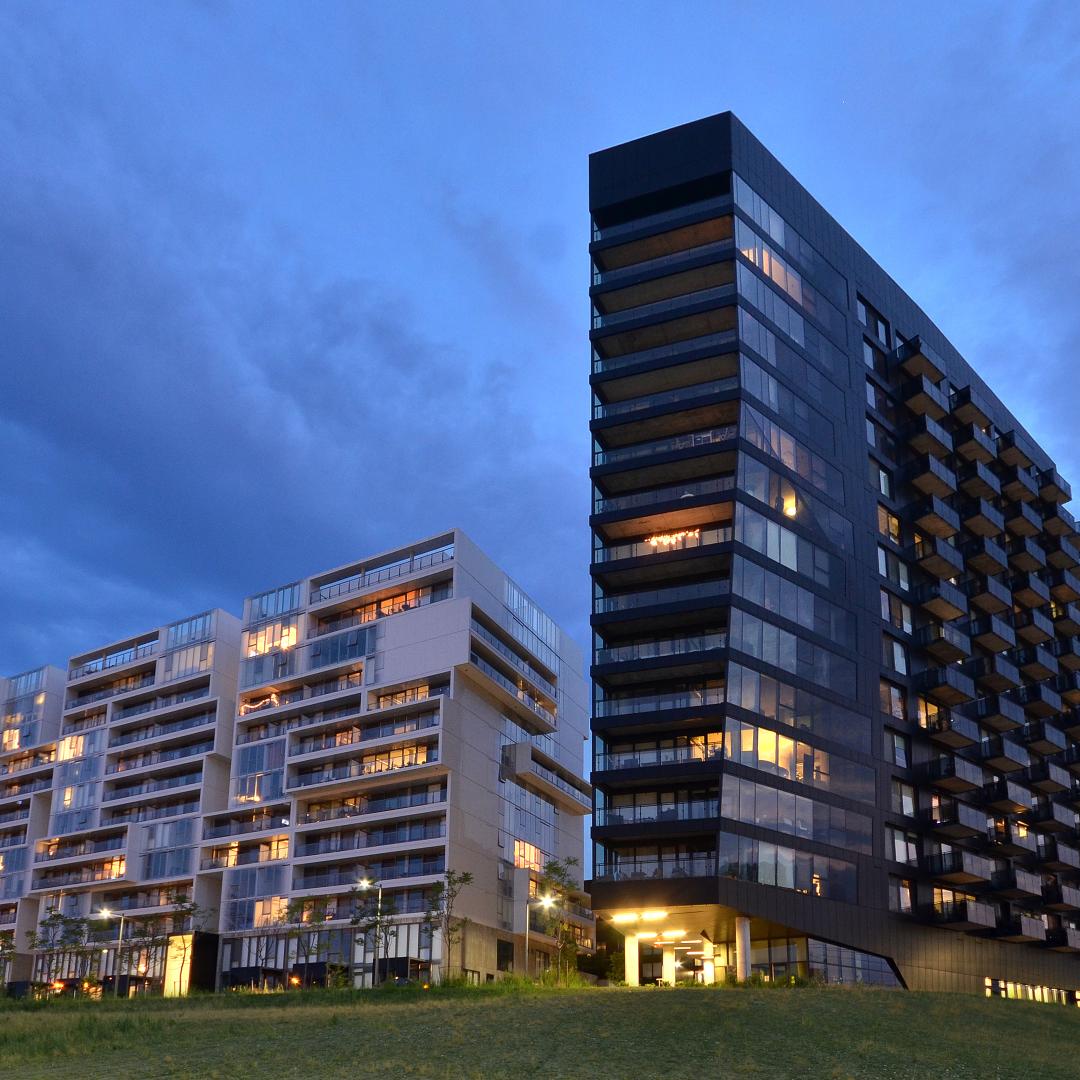 A photo showing the exterior views of the River City Development at dusk