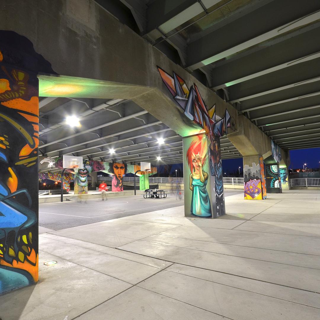 an outdoor skate park with public art murals