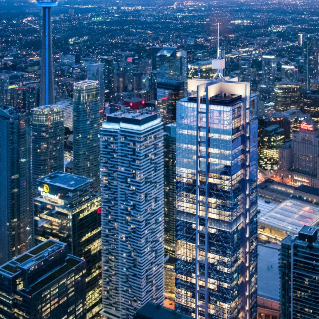 A commercial tower with the CN Tower and downtown core in the background. 