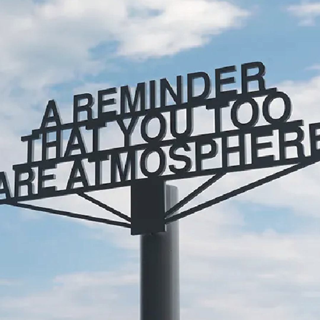 blue sky bvackgound with metal sign that reads: a reminder that you too are atmosphere