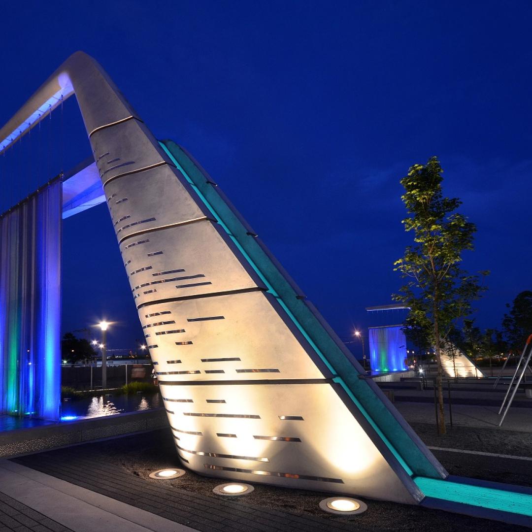 Public art called Light Showers at Sherbourne Common lit up at night
