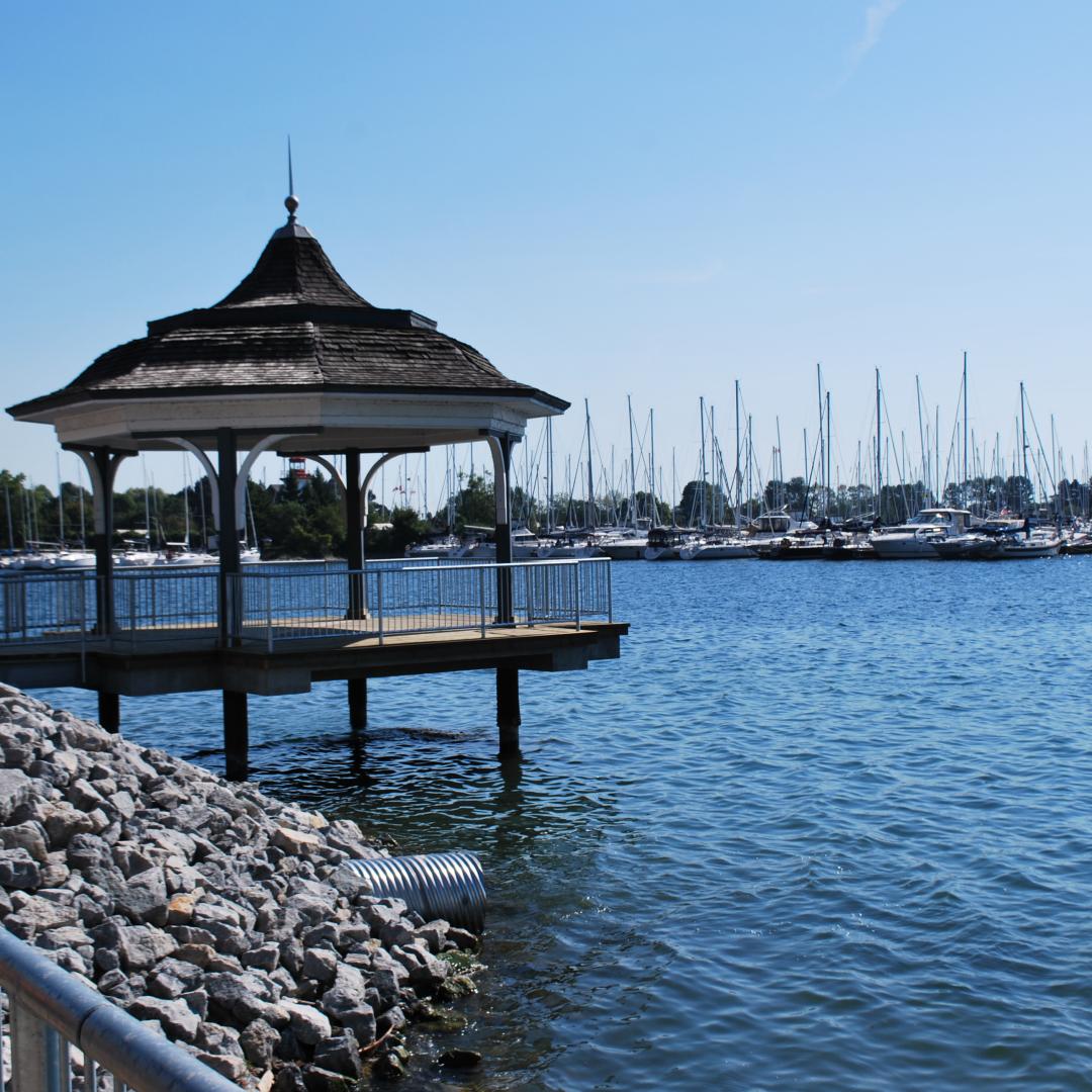 The Mimico Waterfront Park gazebo overlooks Lake Ontario against a backdrop of boats.