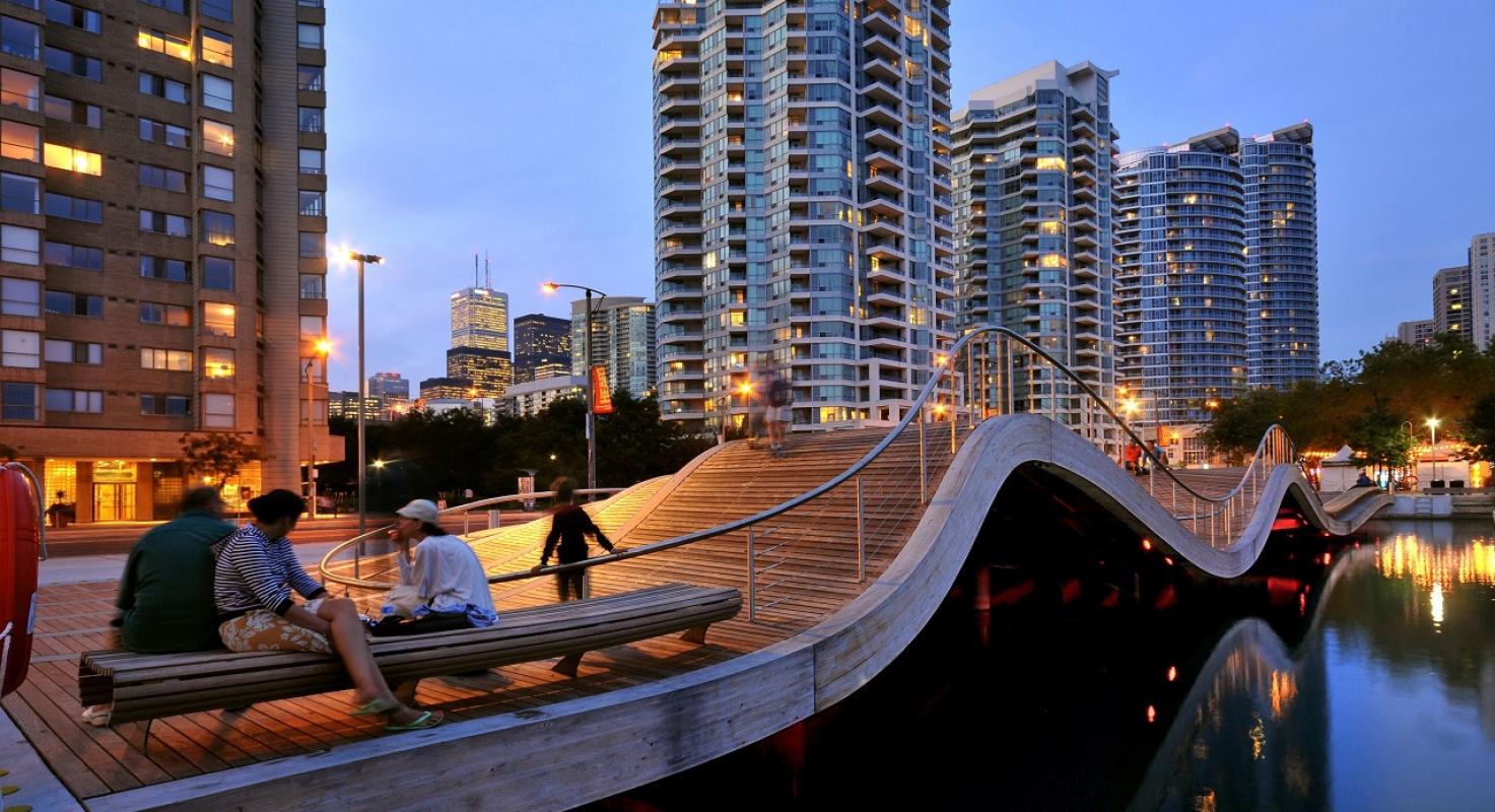 people sitting and enjoying the Simcoe WaveDeck at dusk