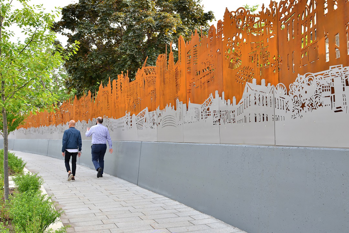 image of long linear artwork that pays homage to the area’s history. The piece features an expanded focus on the Blackburns